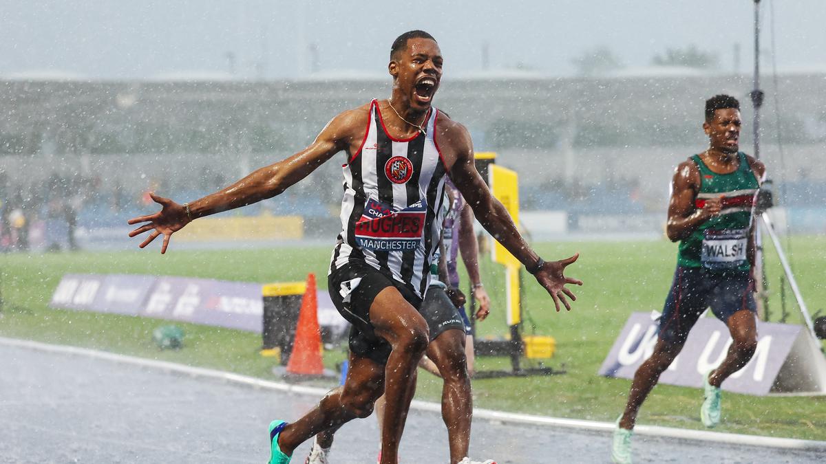 Record-holder Hughes runs to British title in lashing rain