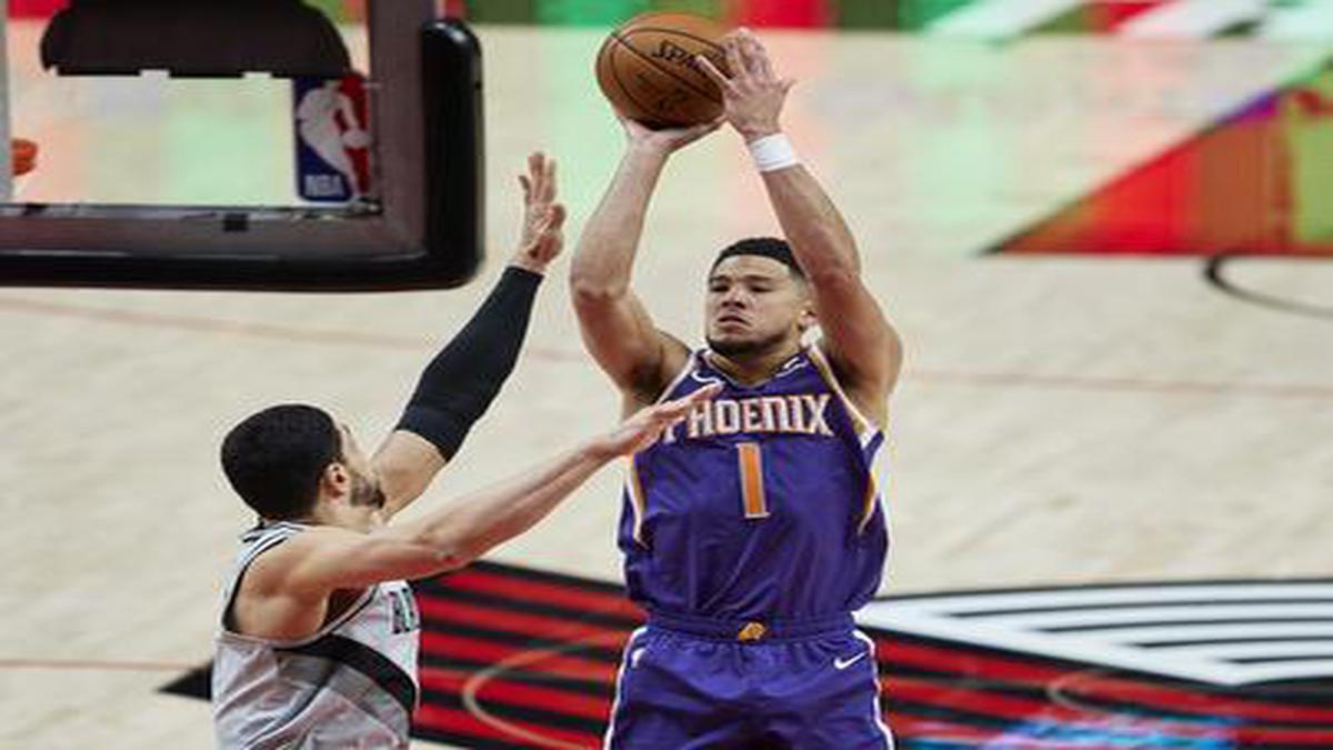 Suns star Devin Booker out vs. Pistons with a right calf strain