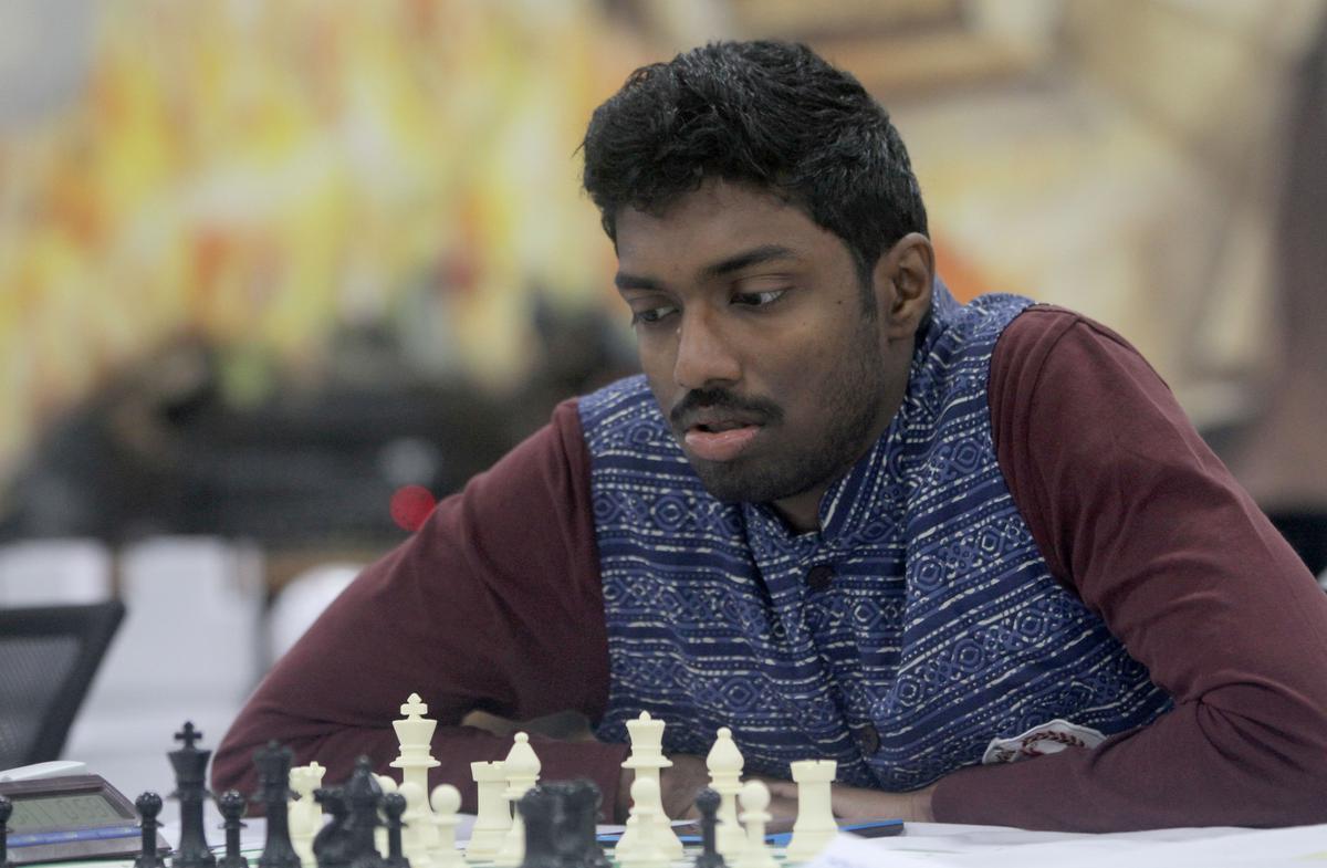 Chennai, Tamil Nadu, India. 29th July, 2022. A chess player gestures prior  the next move during the first round of the 44th Chess Olympiad in Chennai.  The total number of participants is