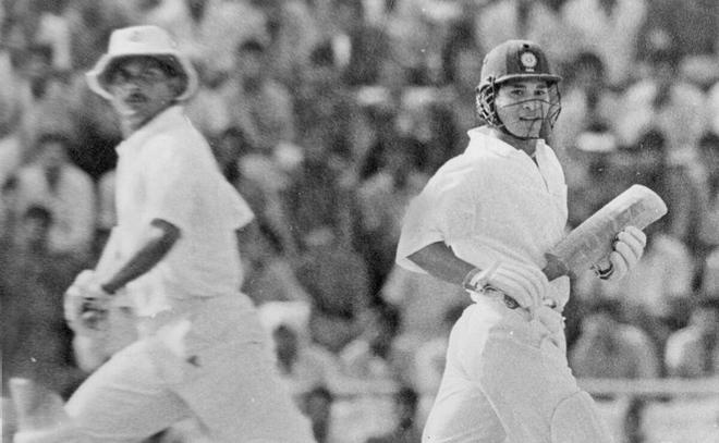 Sachin Tendulkar (right) and Lalchand Rajput follow the course of the ball during their unbeaten third wicket partnership for the Board President’s XI Wills Trophy cricket match at the Karnail Singh Stadium in New Delhi on September 21, 1991.