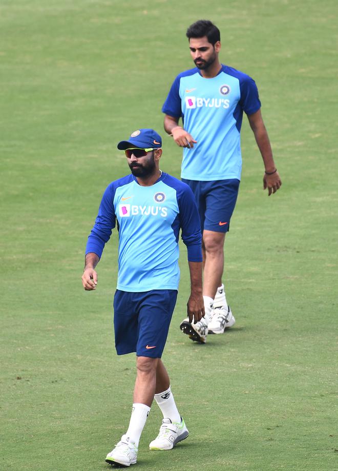 Strike force: Bhuvneshwar Kumar (top), wily but never express-pace, has to mentor the speedsters.