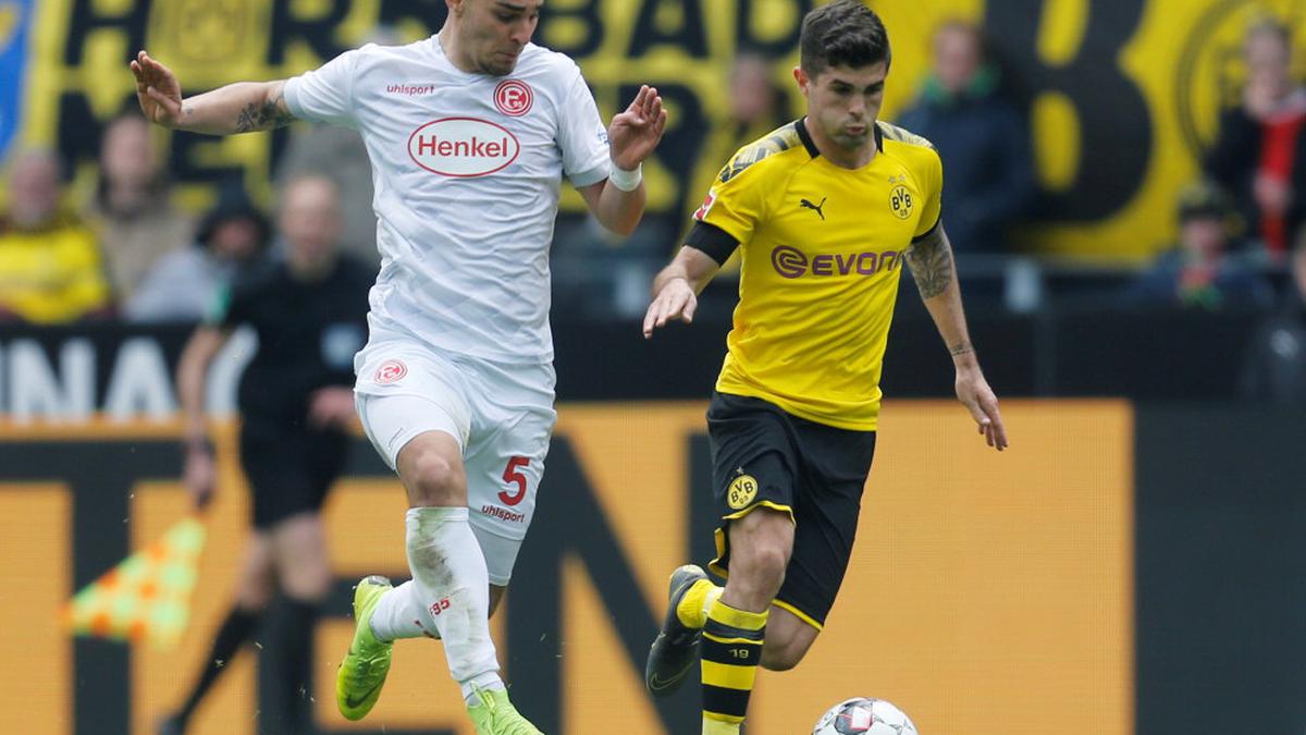 Bundesliga: Borussia Dortmund win against Fortuna Duesseldorf takes title race to wire as Bayern Munich held at RB Leipzig