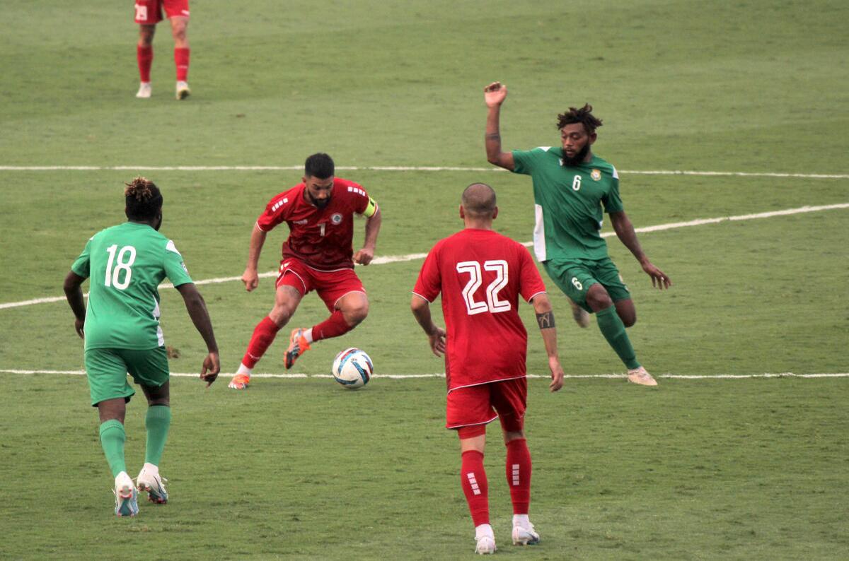 Lebanon captain MaatouK Hassan (Red-No.7) holds the ball to make his strike in the Hero Intercontinental Cup 2023 against Vanuatu at the Kalinga stadium.