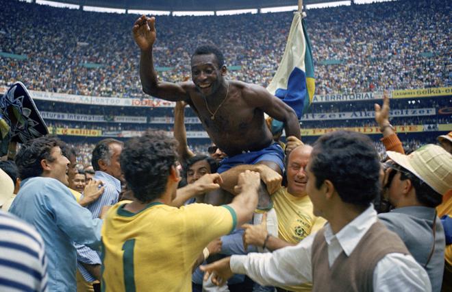 Hero: Pele is hoisted on the shoulders of his team-mates after Brazil’s victory in the FIFA World Cup final of 1970 in Mexico City. This was his third world title with the national team.