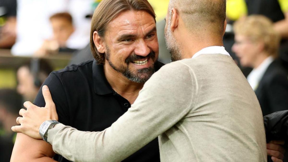 Managers Daniel Farke and Pep Guardiola react after Norwich City's stunning win over defending Premier League champion Manchester City