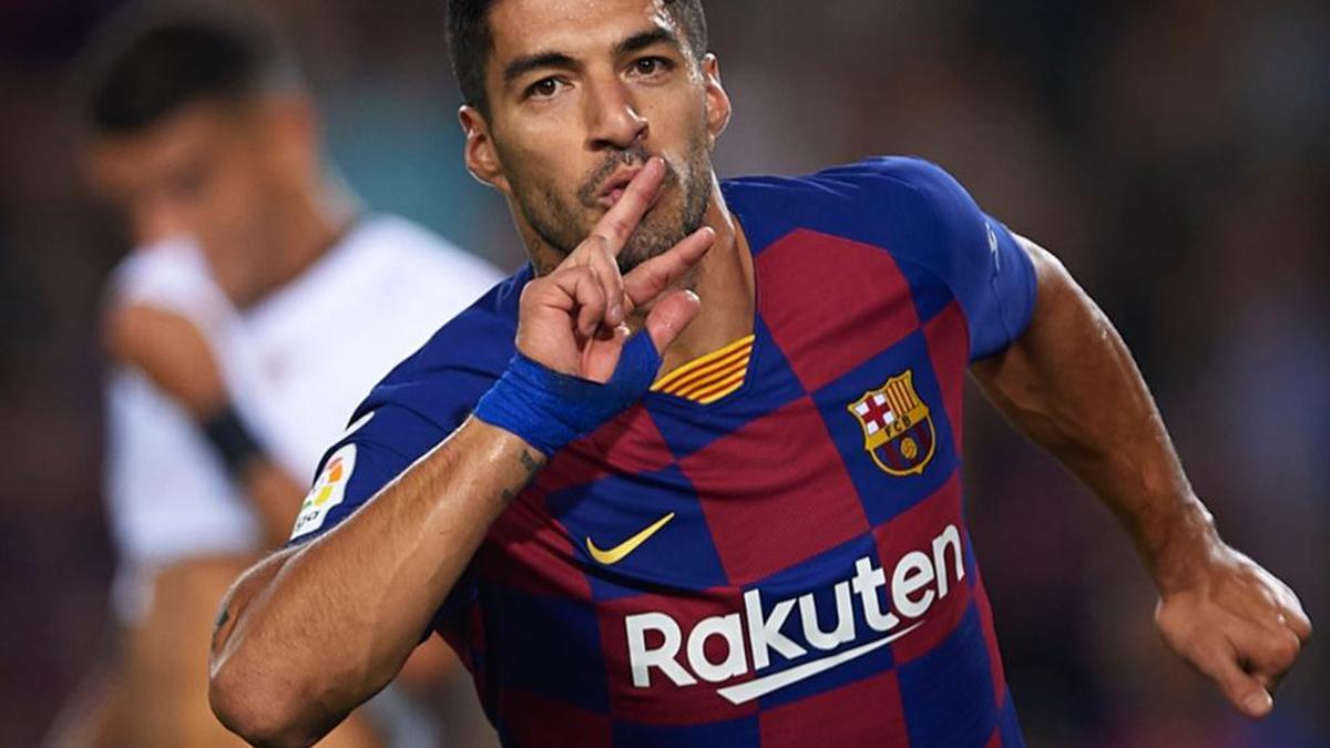 Suarez scores as Barcelona condemns Espanyol to relegation