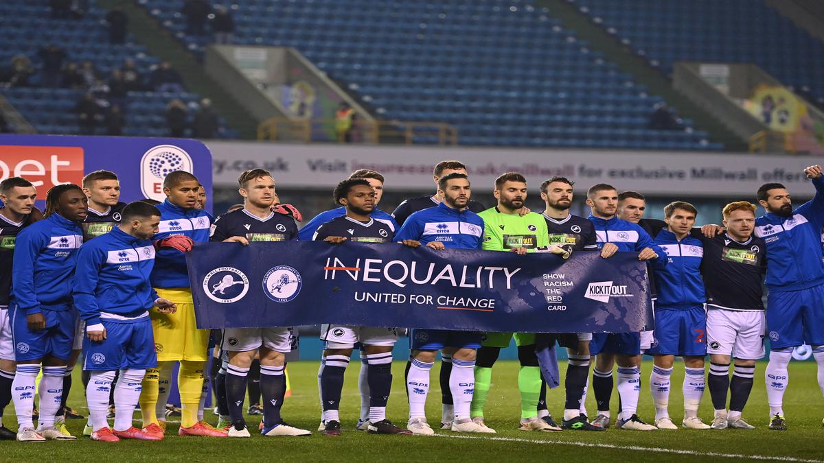 Millwall fans applaud anti-racist banner