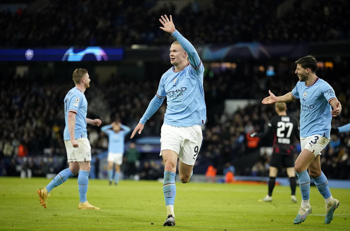 Manchester City’s Erling Haaland shows five with his hand after he scored his 5th goal, the 6-0, during the Champions League round of 16 second leg match between Manchester City and RB Leipzig at the Etihad stadium in Manchester, England, Tuesday, March 14, 2023. 