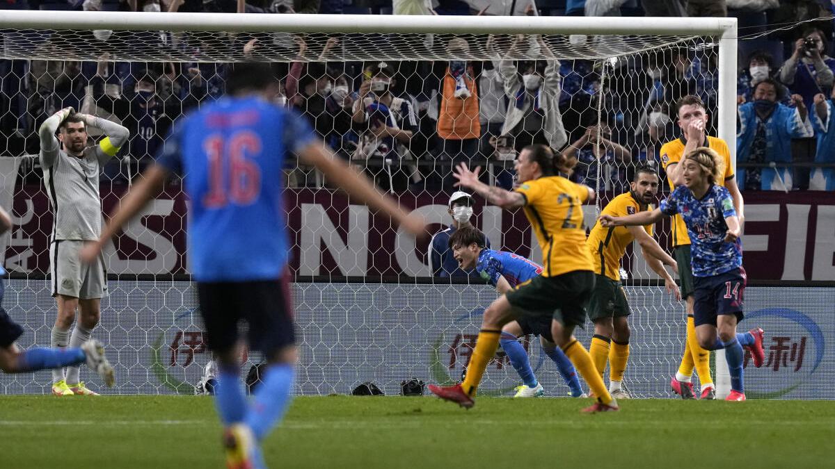 Late own goal ends Australia's record run and hands Japan much-needed win