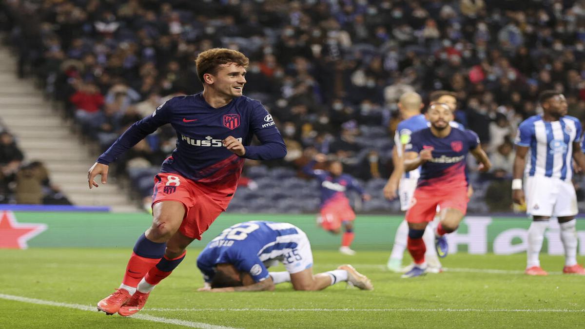 Atletico reaches knockout stage with remarkable win at Porto