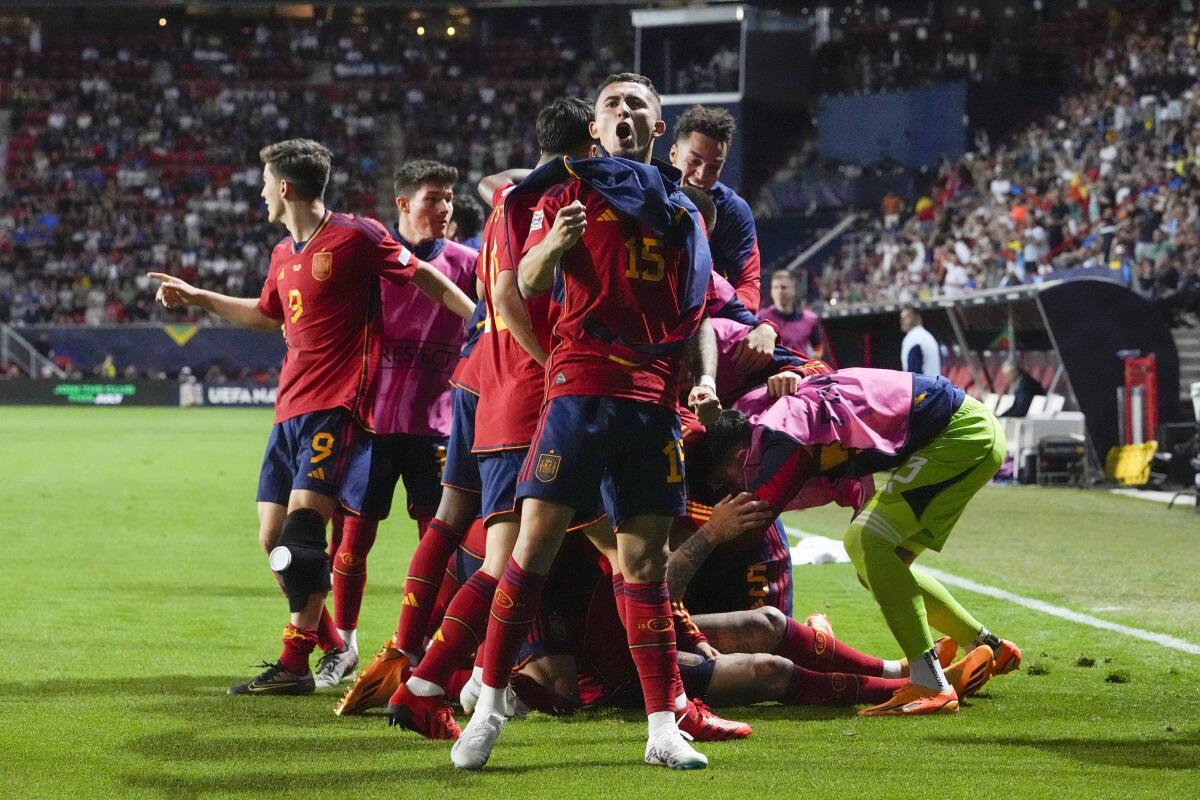 Spain players celebrate after Spain‘s Joselu scored his side’s second goal during the Nations League semifinal soccer match between the Spain and Italy at De Grolsch Veste stadium in Enschede, eastern Netherlands, Thursday, June 15, 2023.