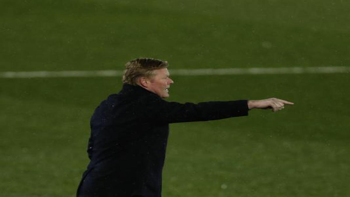 Barcelona coach Koeman feels unfairly treated but wants to stay