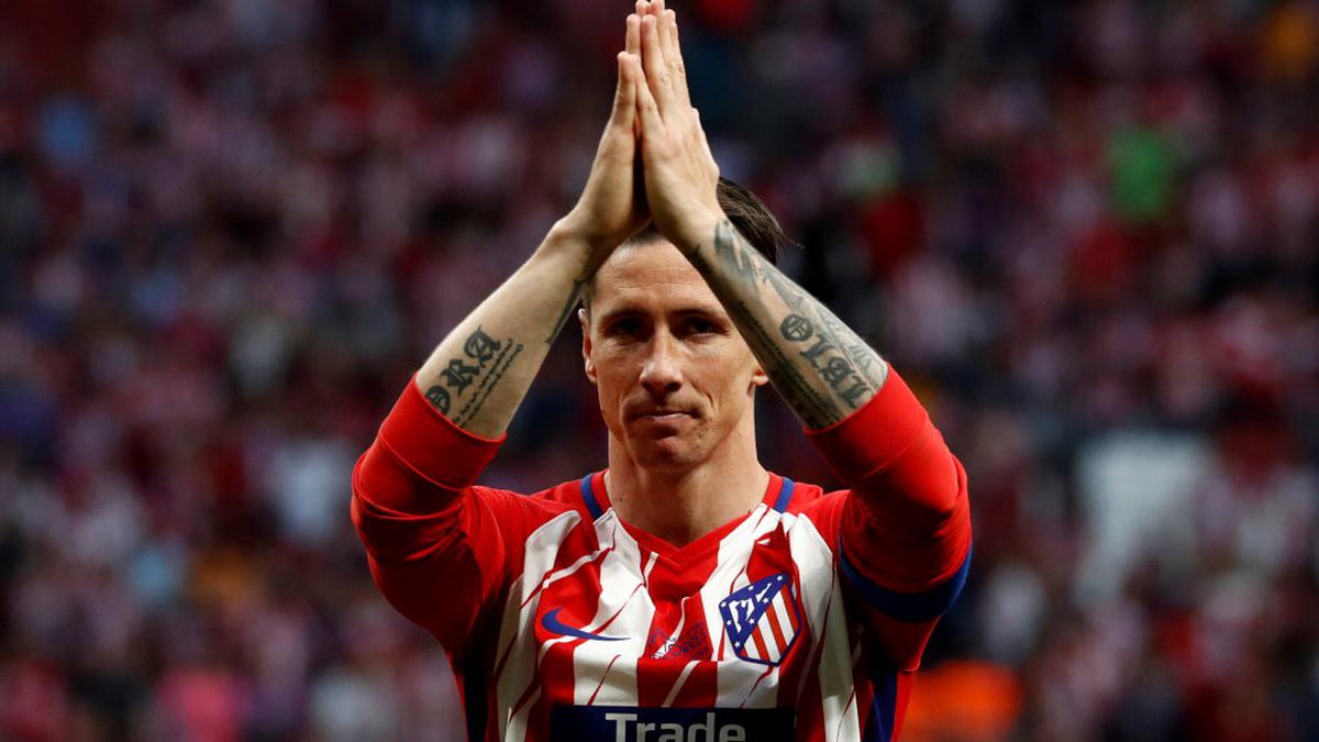 Spain striker Fernando Torres retires from football