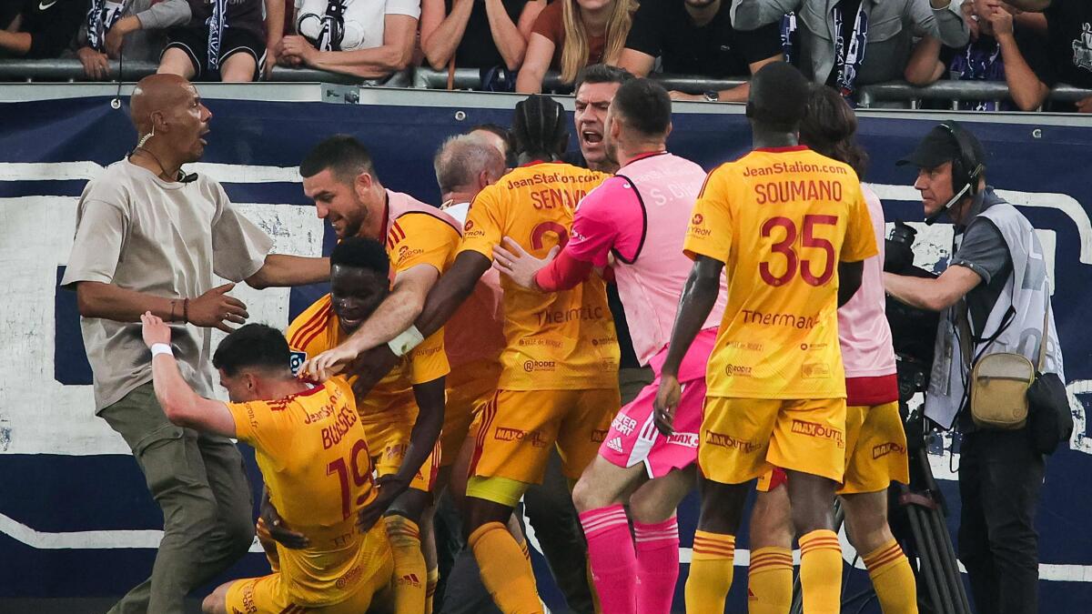 Bordeaux promotion bid in danger after fan assault on Rodez player ends game