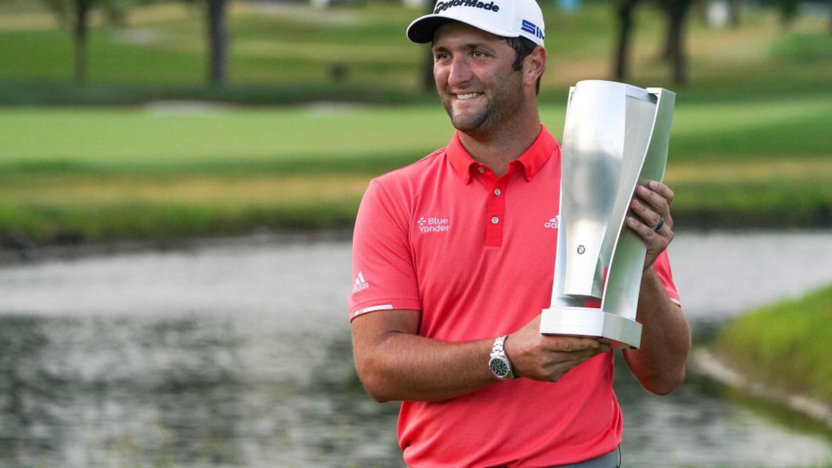 Rahm secures playoff win at Olympia Fields with 66-foot putt