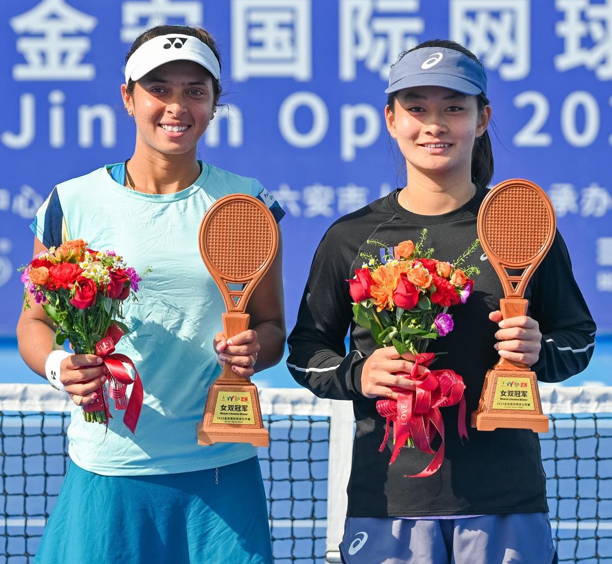 Doubles champions, Ankita Raina and Priska Nugroho, at the ITF women’s tennis tournament in China on Saturday.