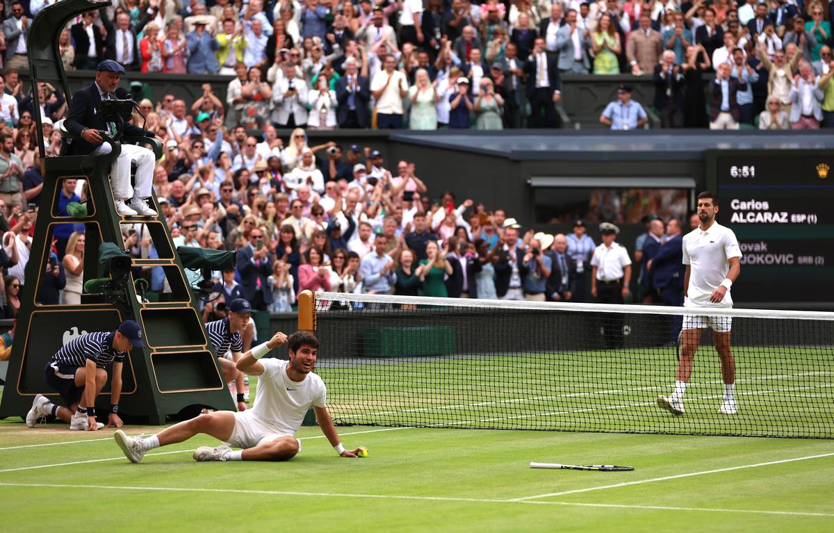 Carlos Alcaraz celebrates after winning the Wimbledon final against Novak Djokovic.