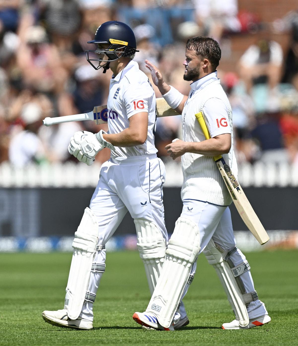 Bethell (left) is consoled by teammate Ben Duckett as he leaves the field after being dismissed after scoring 96 during day two of the second cricket test between New Zealand and England at the Basin Reserve in Wellington.