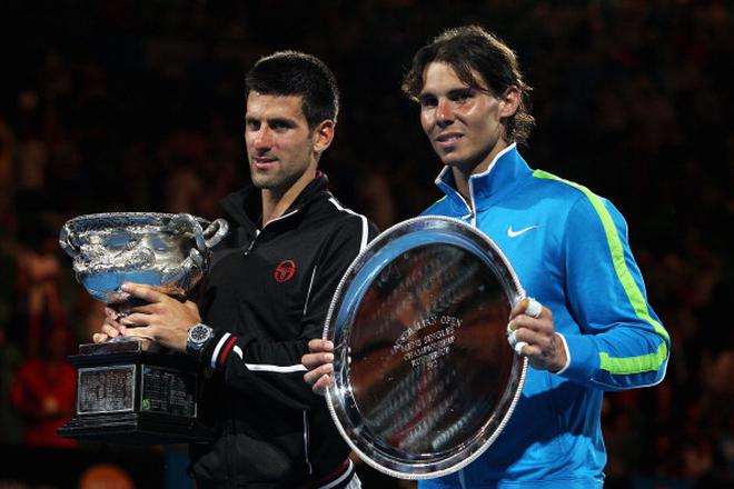 FILE PHOTO: Champion Novak Djokovic of Serbia (left) and runner-up Nadal (right) after the men’s final of the 2012 Australian Open at Melbourne Park on January 29, 2012 in Melbourne.