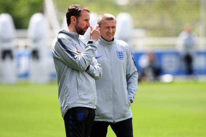 Gareth Southgate, Manager of England and Aidy Boothroyd, Manager of England U21 look on during an England training session at St Georges Park on May 28, 2019 in Burton-upon-Trent, England.