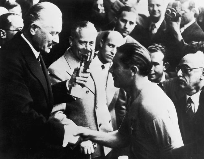 Italian captain Giuseppe Meazza receives the Jules Rimet trophy after his team’s 4-2 victory over Hungary in the World Cup final at the Stade Olympique de Colombes, Paris.