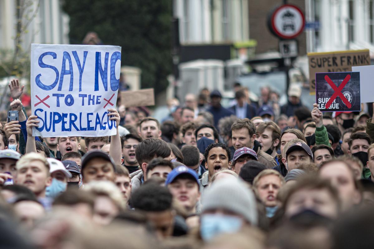Fans of Chelsea Football Club protest against the European Super League outside Stamford Bridge on April 20, 2021 in London, England. Only Real Madrid and Barcelona remain in list of clubs interested in the new league so far.