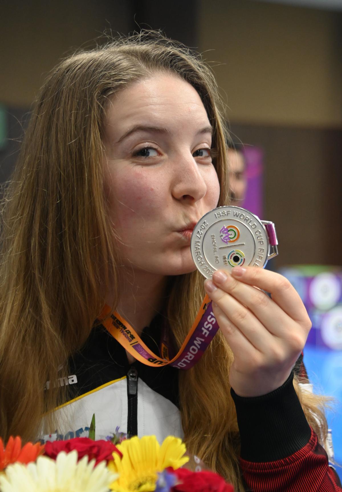 Doreen Vennekamp of Germany poses with her ISSF World Cup silver medal at the Madhya Pradesh Shooting Academy in Bhopal.