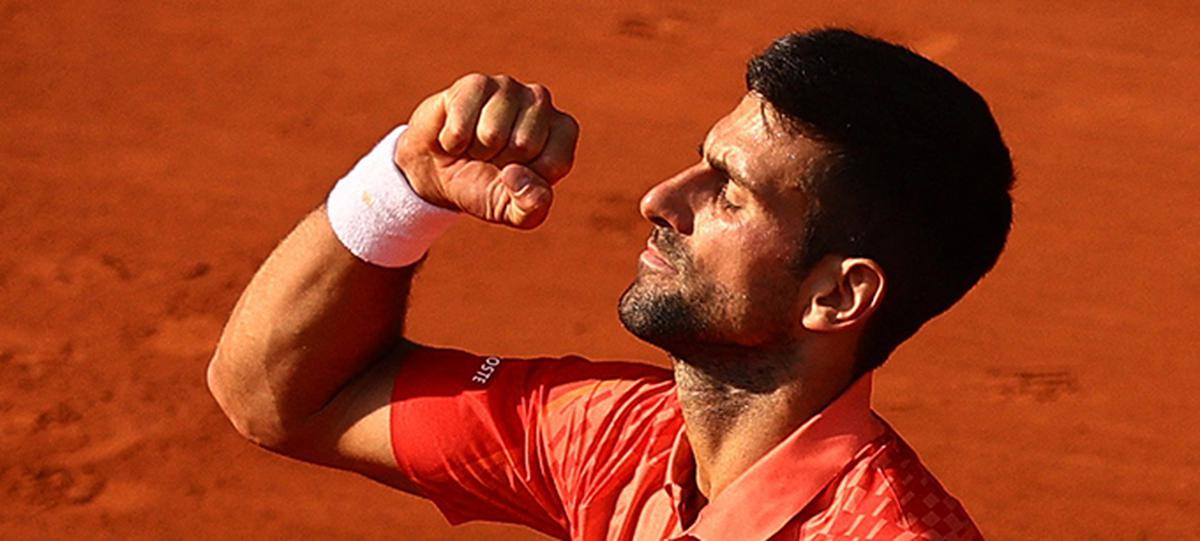 Djokovic celebrates after winning his semifinal match against Carlos Alcaraz at the French Open.