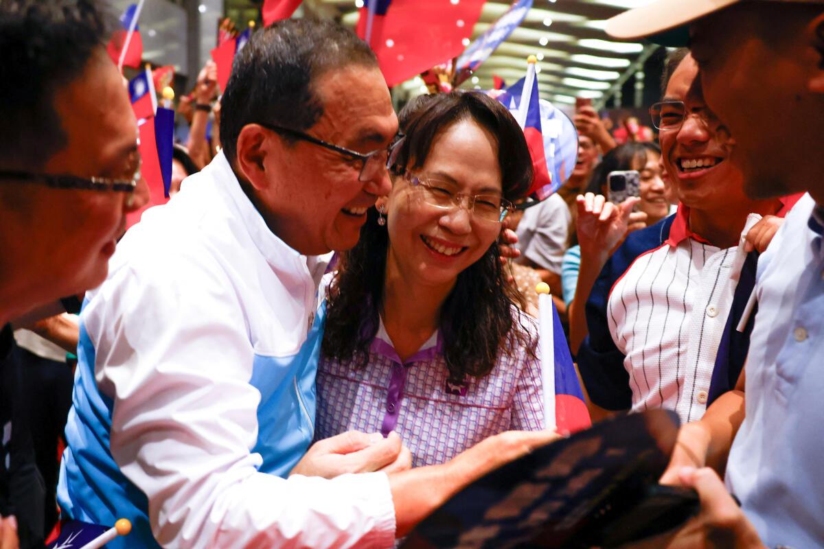 The mother of Boxer Lin Yu-ting reacts after she won the gold medal at the Paris Olympics, in Taipei Taiwan August 11, 2024.