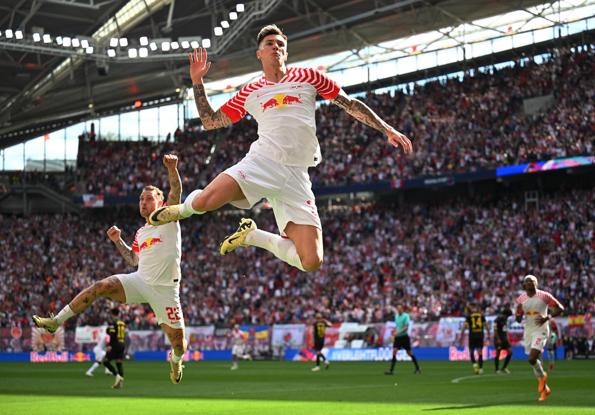 Benjamin Sesko celebrates scoring a goal for RB Leipzig during the Bundesliga match between against Borussia Dortmund in Leipzig, Germany.