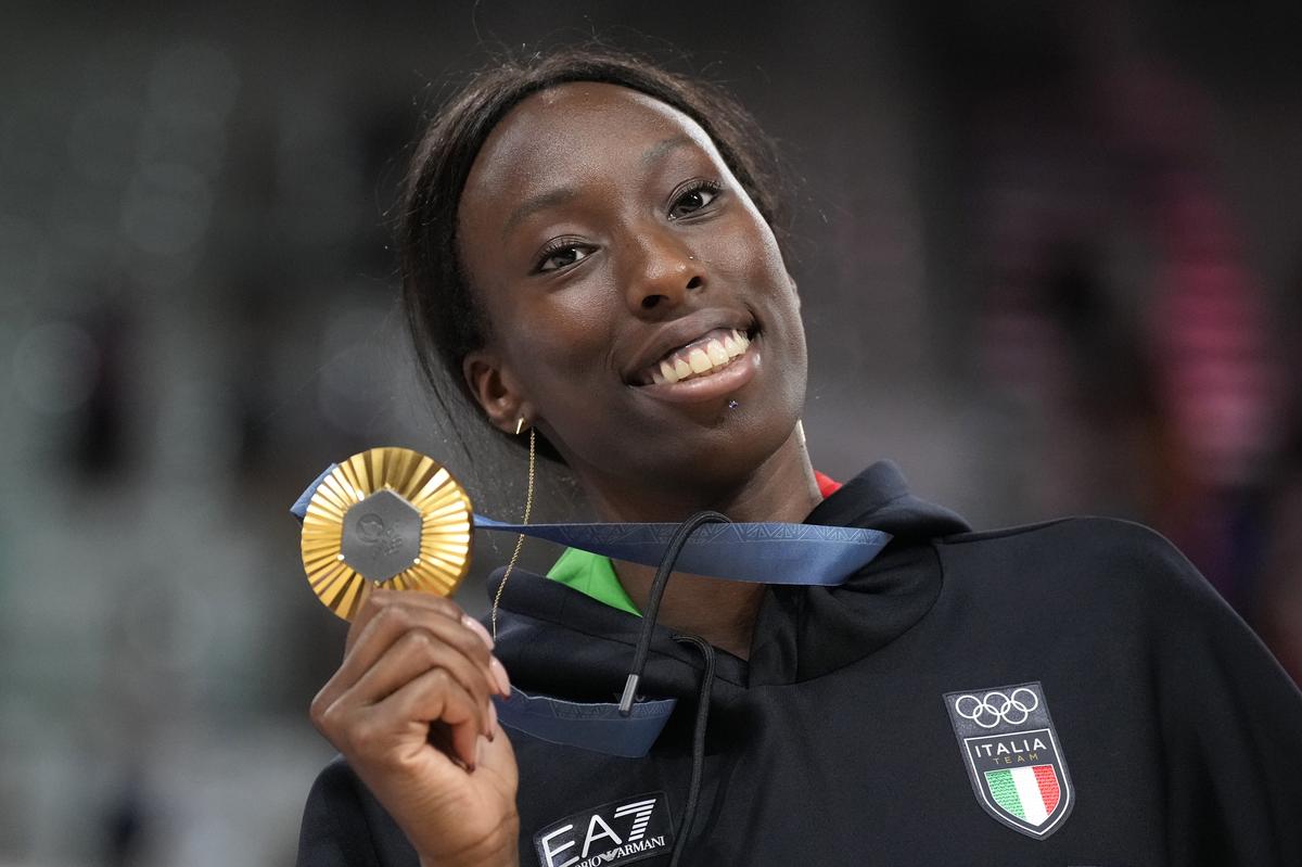 Paola Egonu of Italy shows her gold medal after the medal ceremony at the end of the women’s volleyball final match against the United States of America at the 2024 Summer Olympics.