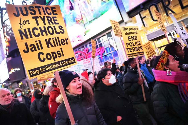 People march on while protesting the death of Tyre Nichols on January 27, 2023 in New York City. 