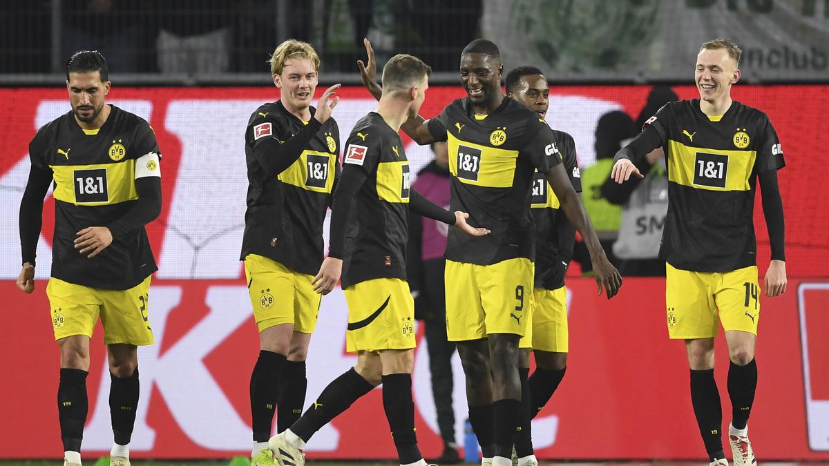 Bundesliga 2024-25: Borussia Dortmund holds on with 10 men to beat Wolfsburg 3-1