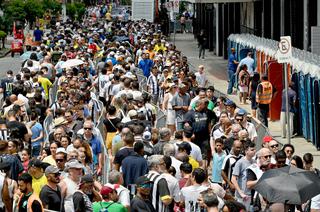 Mourners queue outside Vila Belmiro stadium to pay their respects to Pele before his funeral.