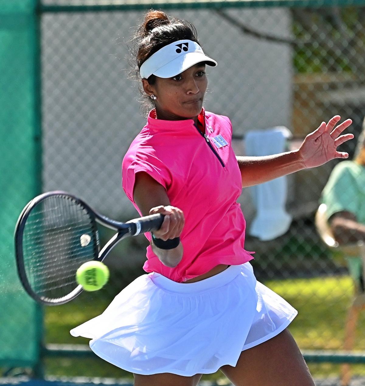 Photo of, Sahaja Yamalapalli swings into her explosive forehand in the
match against Carlota Cirez in the ITF women’s tennis tournament in
Gurugram on Wednesday. 