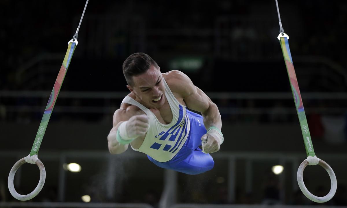 Greece’s Eleftherios Petrounias performs on the rings during the artistic gymnastics men’s apparatus final at the 2016 Summer Olympics.