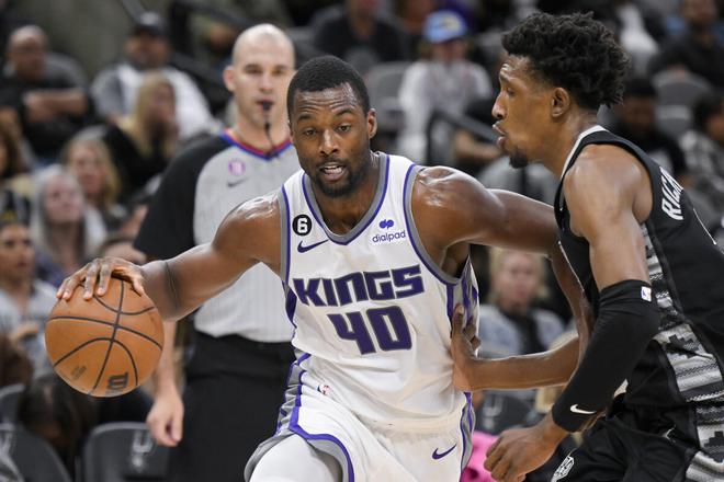 Sacramento Kings’ Harrison Barnes drives against San Antonio Spurs’ Josh Richardson. 