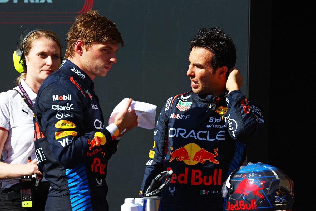 Verstappen and Perez talk in parc ferme during the F1 Grand Prix of United States at Circuit of The Americas on October 20, 2024 in Austin, Texas.