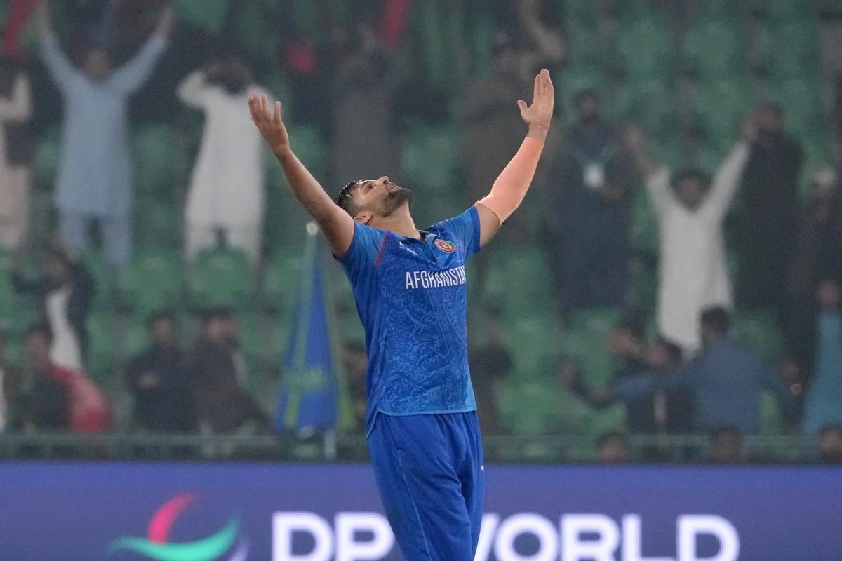 Afghanistan’s Azmatullah Omarzai celebrates taking the final wicket of England that secured their win in the ICC Champions Trophy match in Lahore, Pakistan.