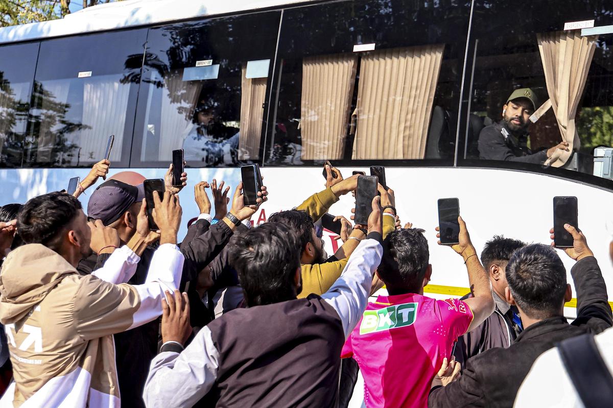 Fans gather outside the SMS Stadium to take photos of Rohit Sharma.