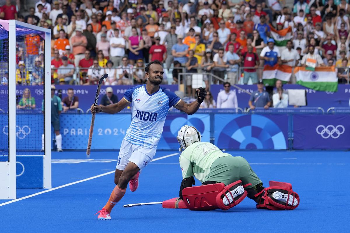 India’s Lalit Kumar Upadhyay, left, celebrates after scoring goal in the shoot-out during the men’s quarterfinal field hockey match between Britain and India at the Yves-du-Manoir Stadium during the 2024 Summer Olympics, Sunday, Aug. 4, 2024, in Colombes, France. 