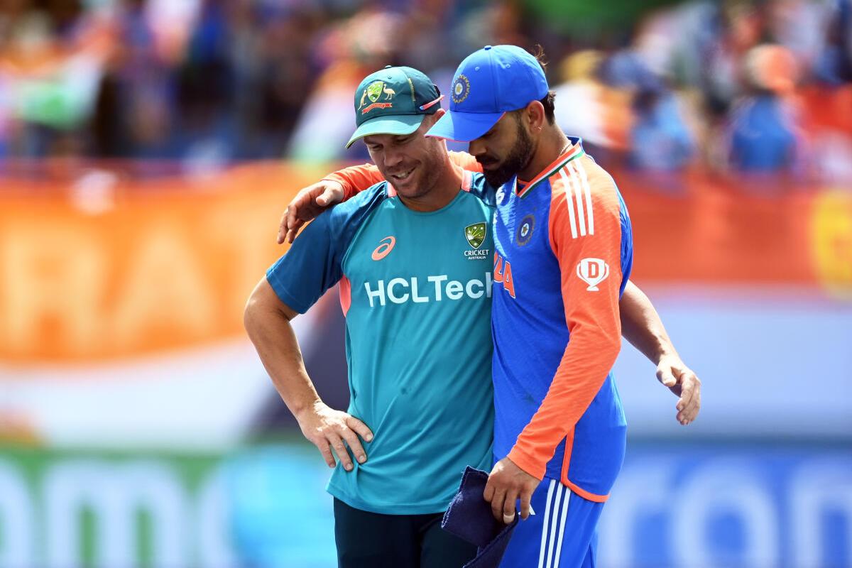 David Warner and Virat Kohli share a light moment ahead of India’s T20 World Cup 2024 Super Eight game at the Daren Sammy National Cricket Stadium in Gros Islet, Saint Lucia.