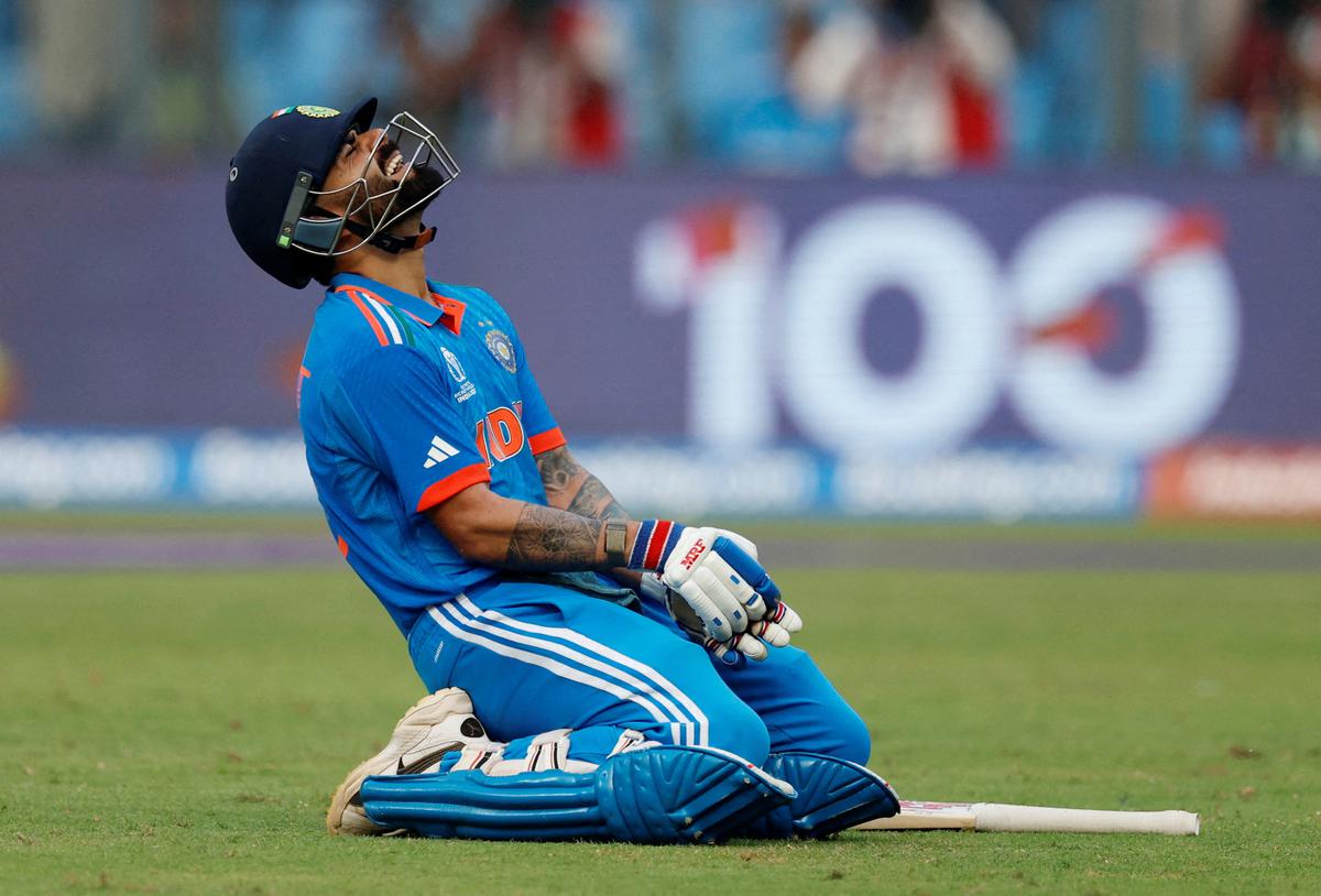 India’s Virat Kohli celebrates after reaching his 50th century, breaking Sachin Tendulkar’s record.