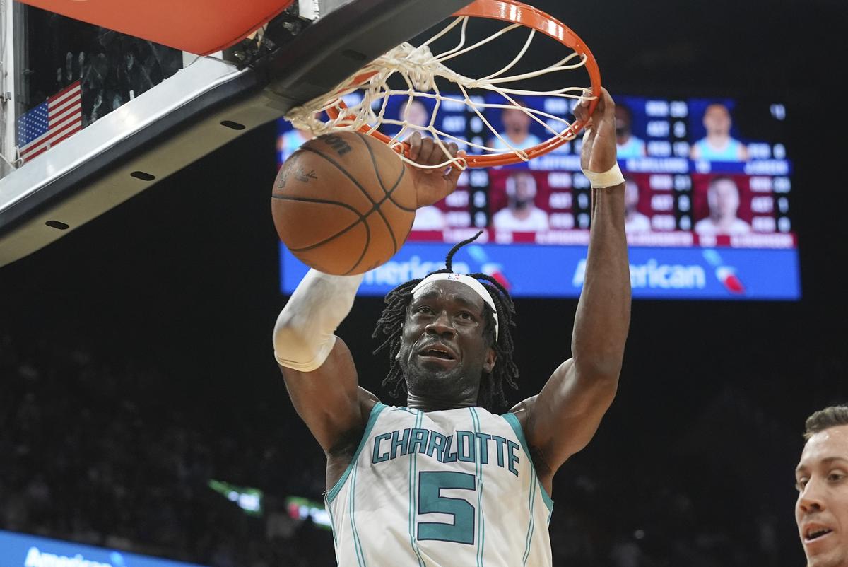 Charlotte Hornets center Mark Williams (5) dunks the ball during the second half of an NBA basketball game against the Miami Heat.