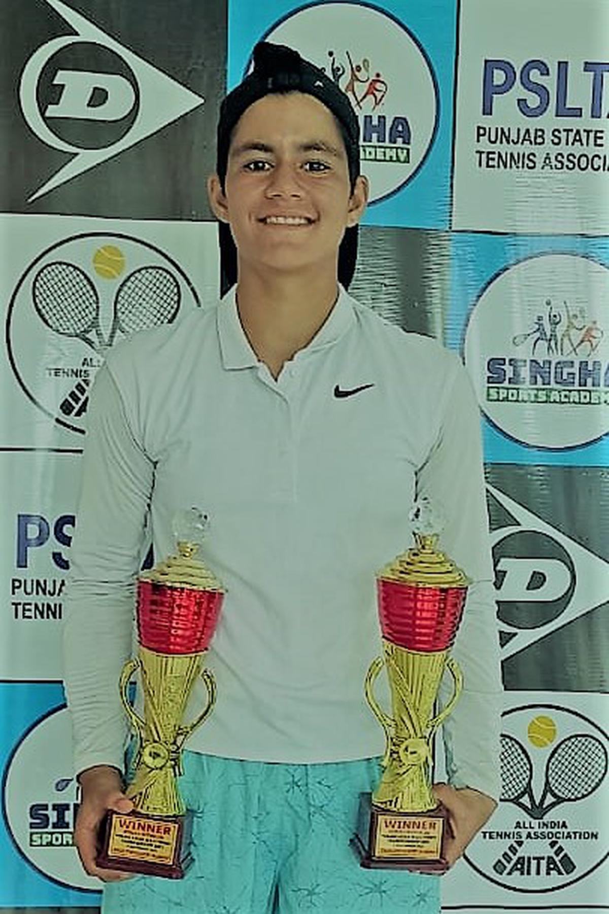 Riya Sachdeva with the girls singles and doubles trophies in the Asian under-16 tennis tournament in Jalandhar. 