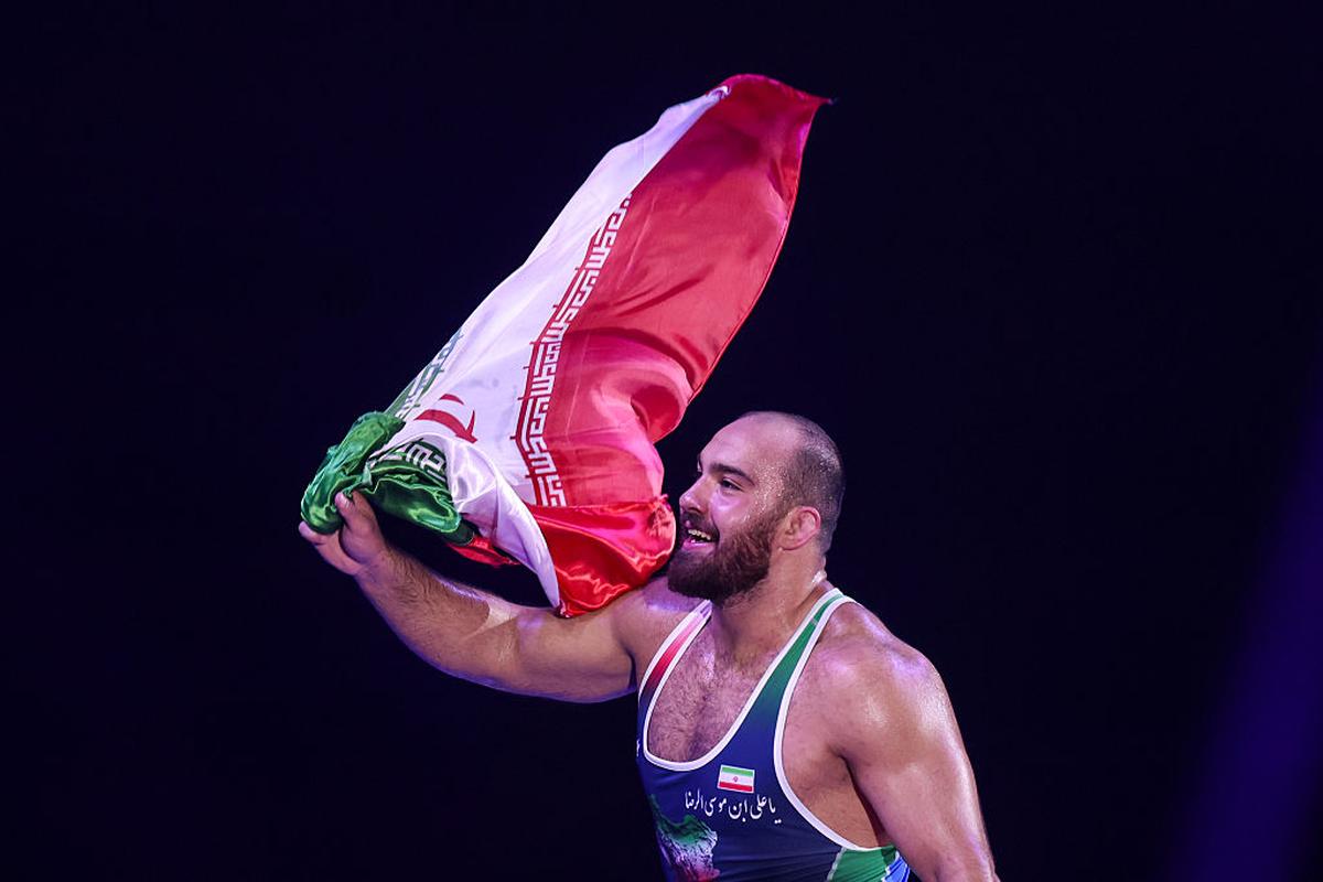 File photo: Amir Hossein Zare celebrated his win by holding Iran’s flag aloft and spared a thought for his countrymen, who were bearing the brunt of the war back home.