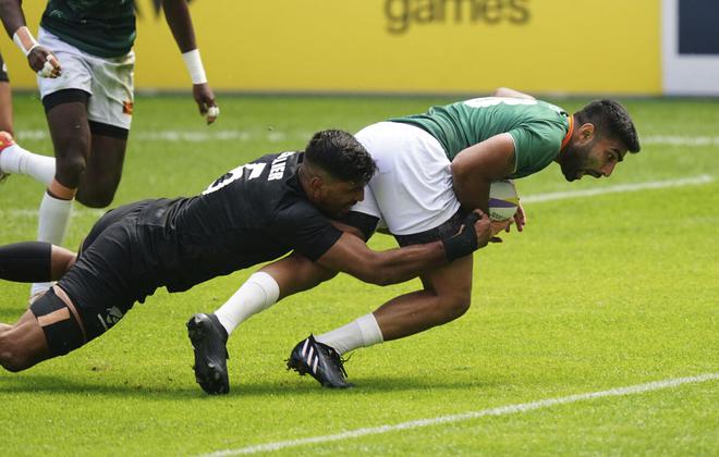 Sri Lanka’s Ashan Ratwatte (right) scores against New Zealand during the Men’s Pool D Rugby Sevens match on day one of the 2022 Commonwealth Games at Coventry Stadium in Coventry on Friday. 