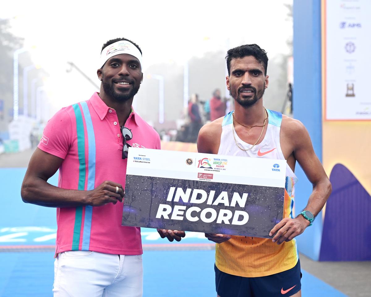Indian men’s event winner and record-holder Gulveer Singh (right) with Kenny Bednarek, the international event ambassador.