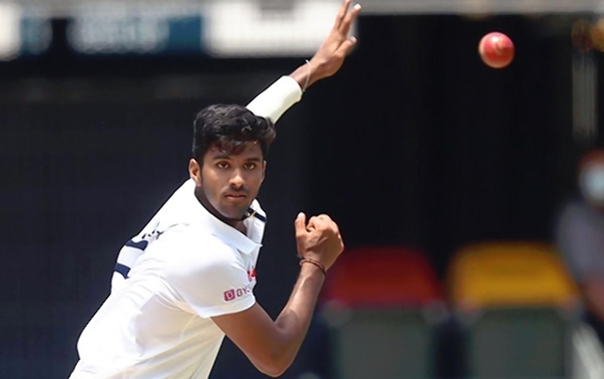 FILE PHOTO: India’s Washington Sundar bowls on day four of the fourth cricket Test match between Australia and India at The Gabba in Brisbane.