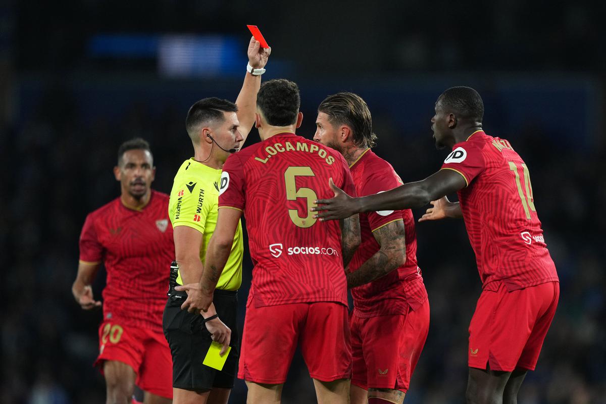 Referee Ortiz Arias shows a red card to Sergio Ramos of Sevilla during the match against Real Sociedad. 